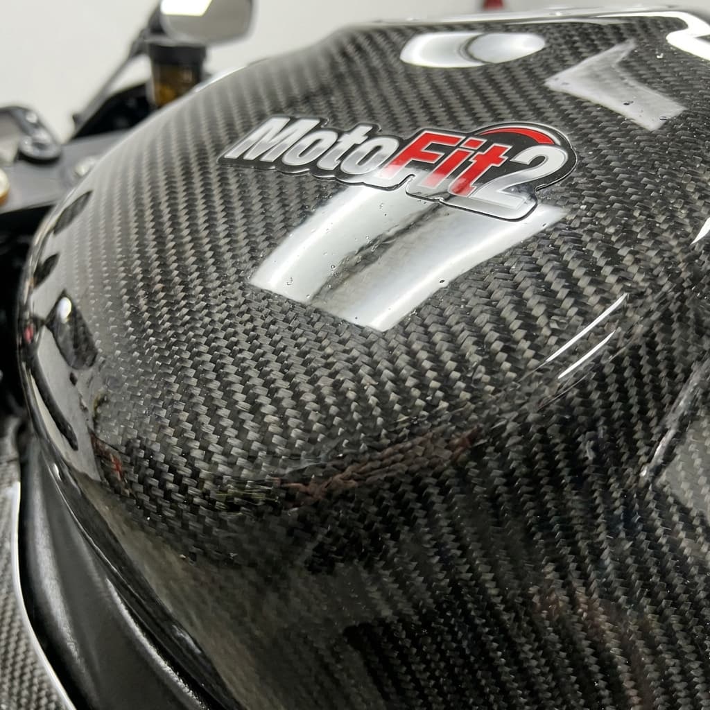 Carbon Fiber Detailing - Macro shot of custom carbon fiber layups. SEO: bike-detailing-ahmedabad